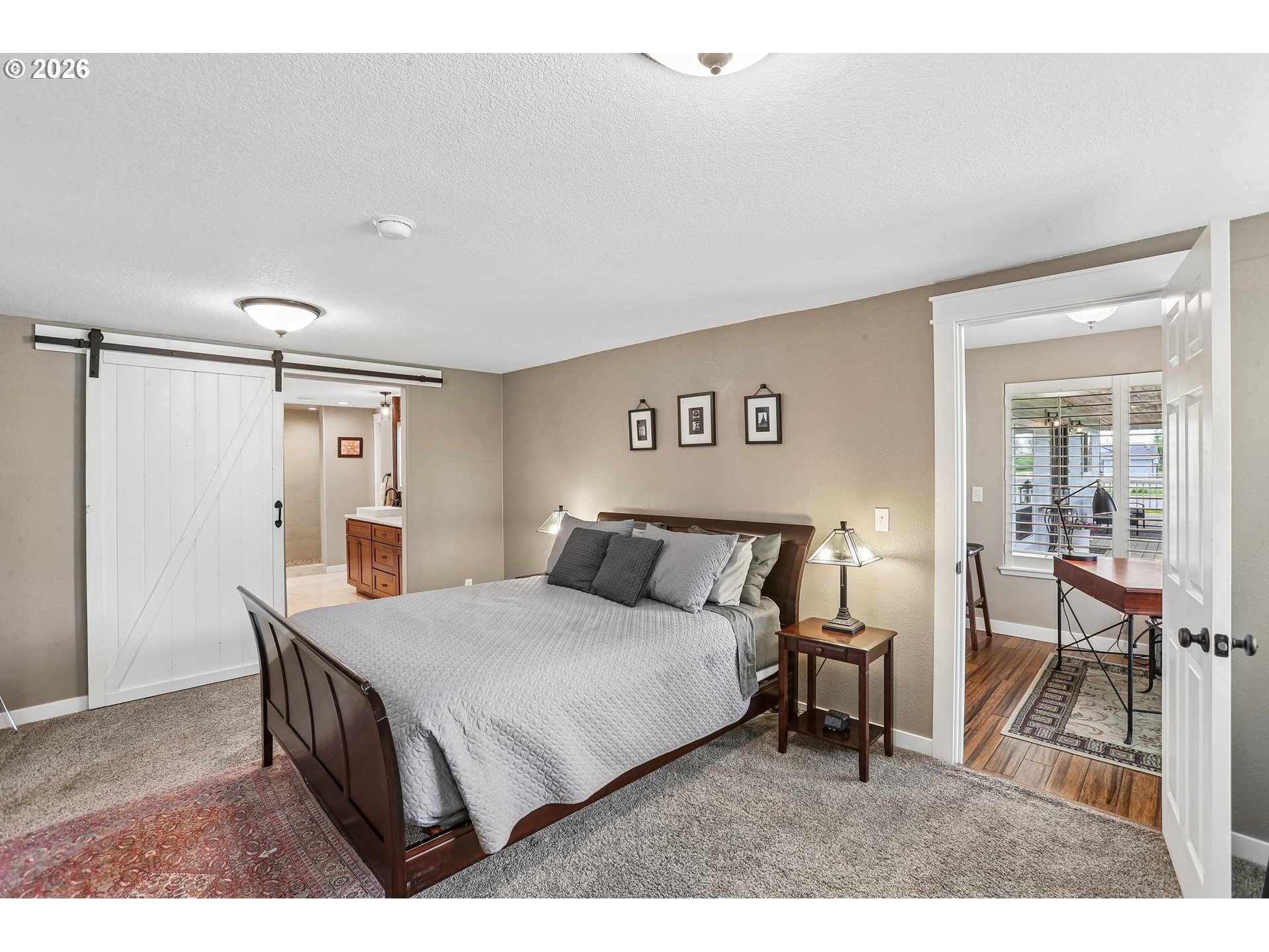 298 Roberson Road Woodland, WA 98674 - Photo 12 of 48 a bed room with a bed and a table