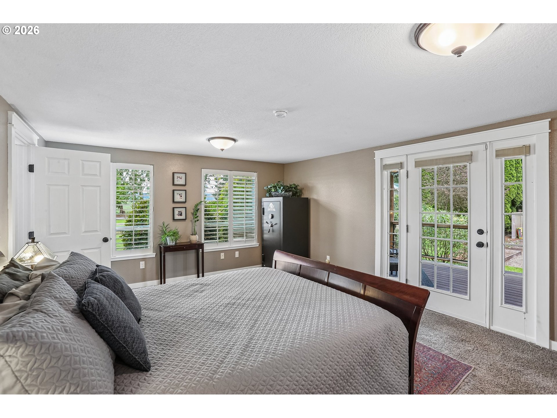 298 Roberson Road Woodland, WA 98674 - Photo 13 of 48 a bedroom with a large bed and a large window