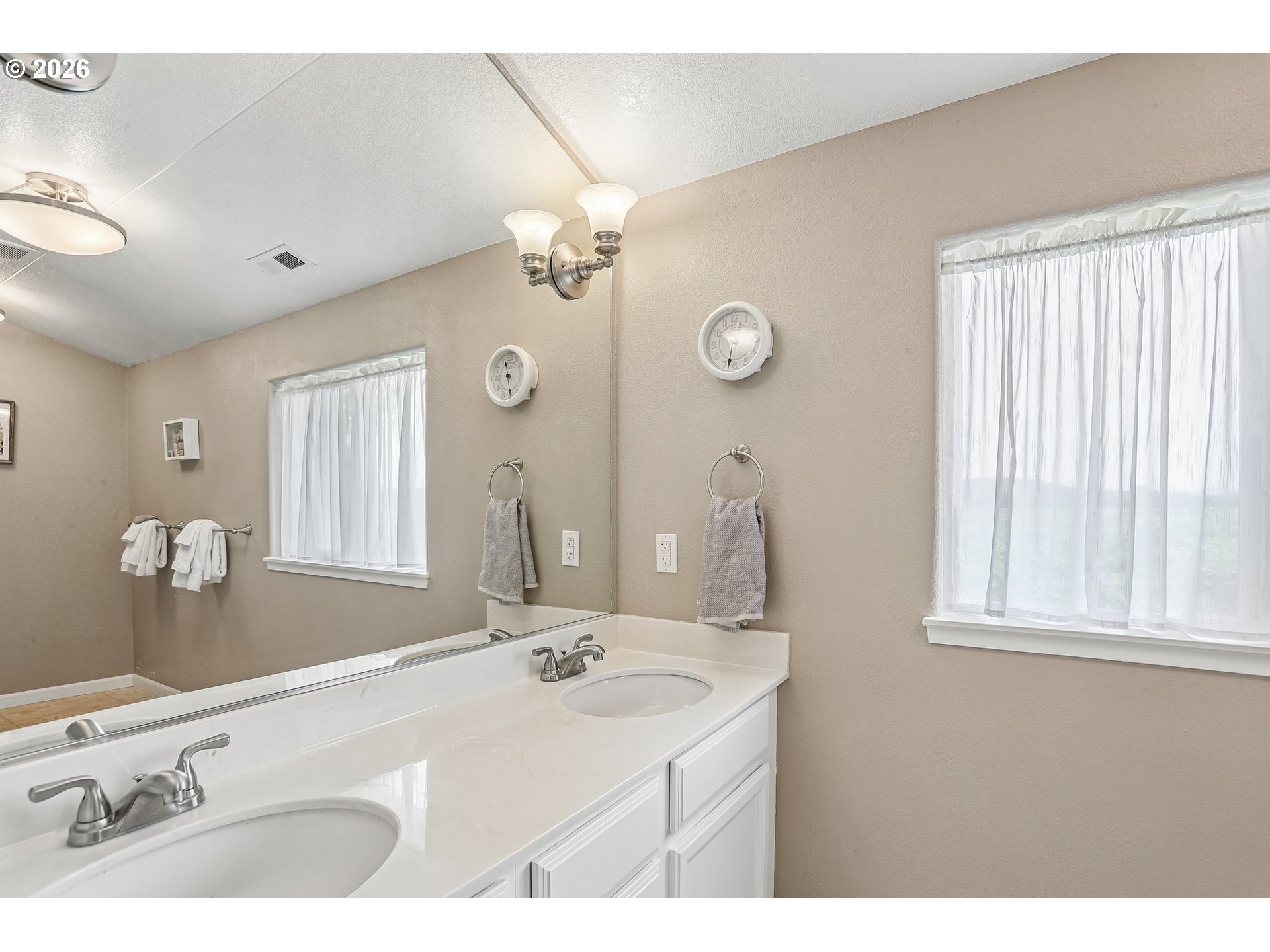 298 Roberson Road Woodland, WA 98674 - Photo 19 of 48 a bathroom with a sink a mirror and a window