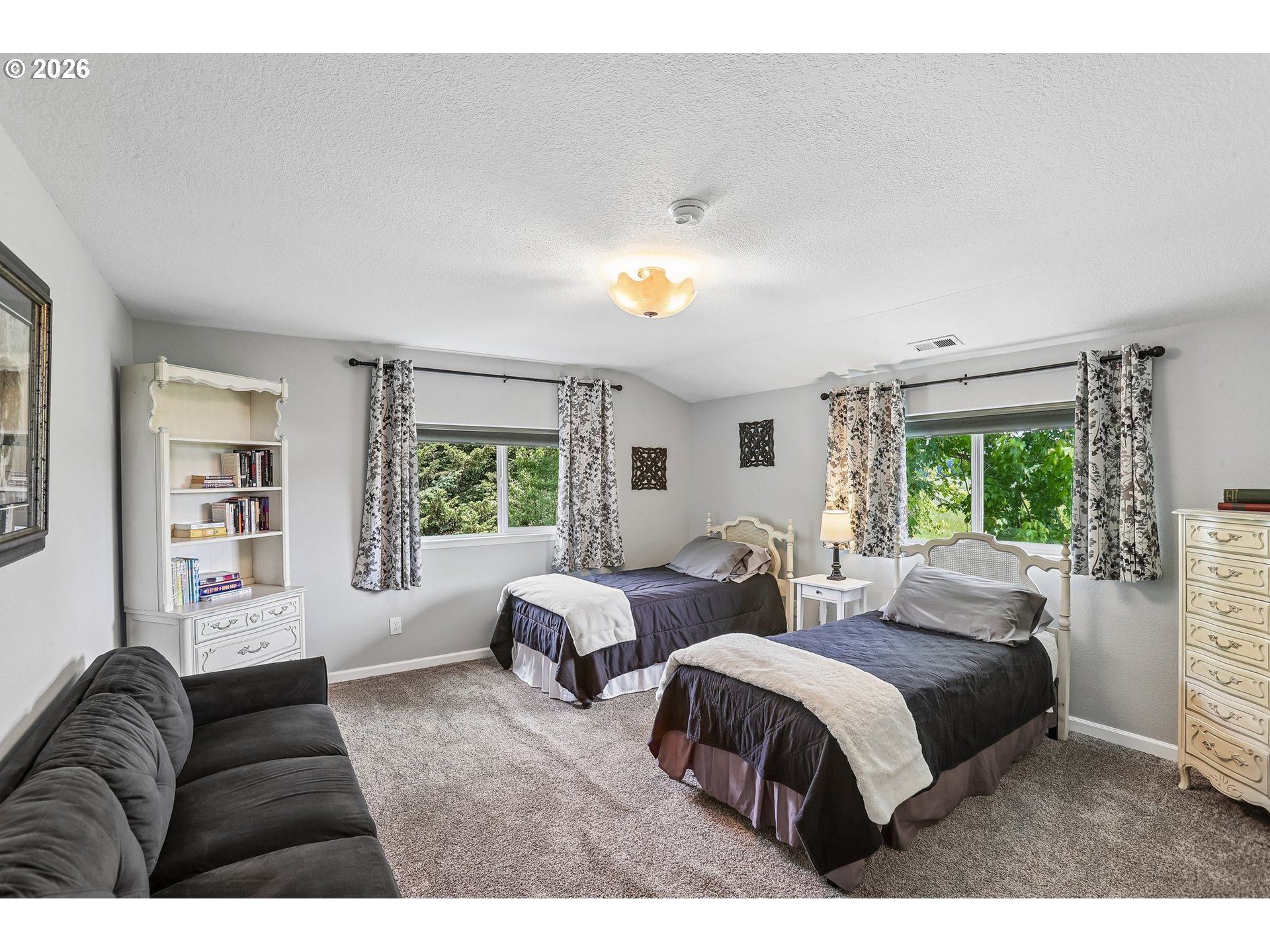 298 Roberson Road Woodland, WA 98674 - Photo 21 of 48 a bedroom with two beds and a large window