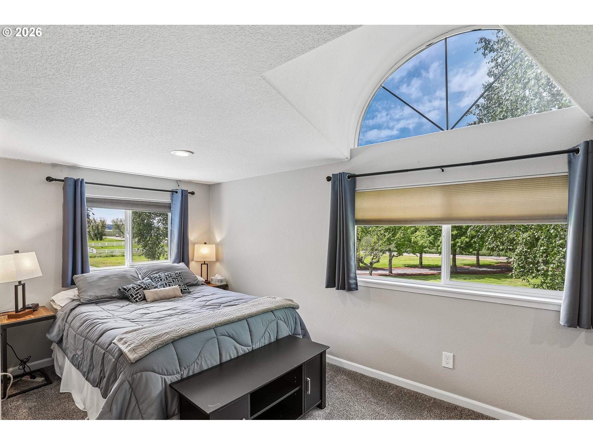 298 Roberson Road Woodland, WA 98674 - Photo 22 of 48 a bedroom with a large bed and a window