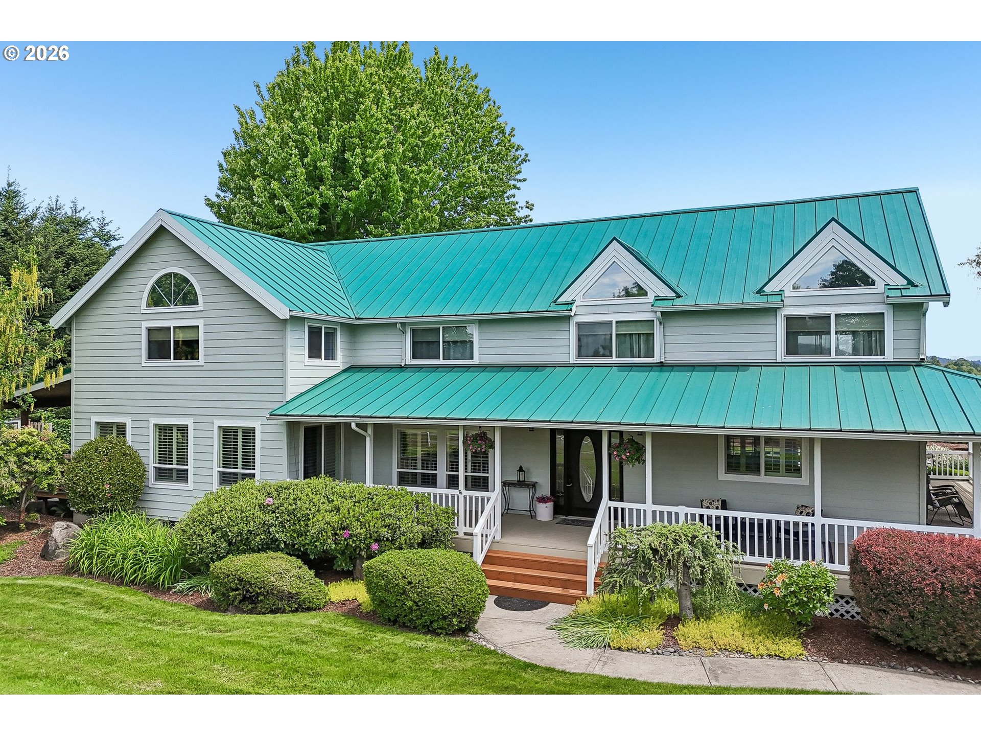 298 Roberson Road Woodland, WA 98674 - Photo 3 of 48 a front view of a house with a yard and potted plants