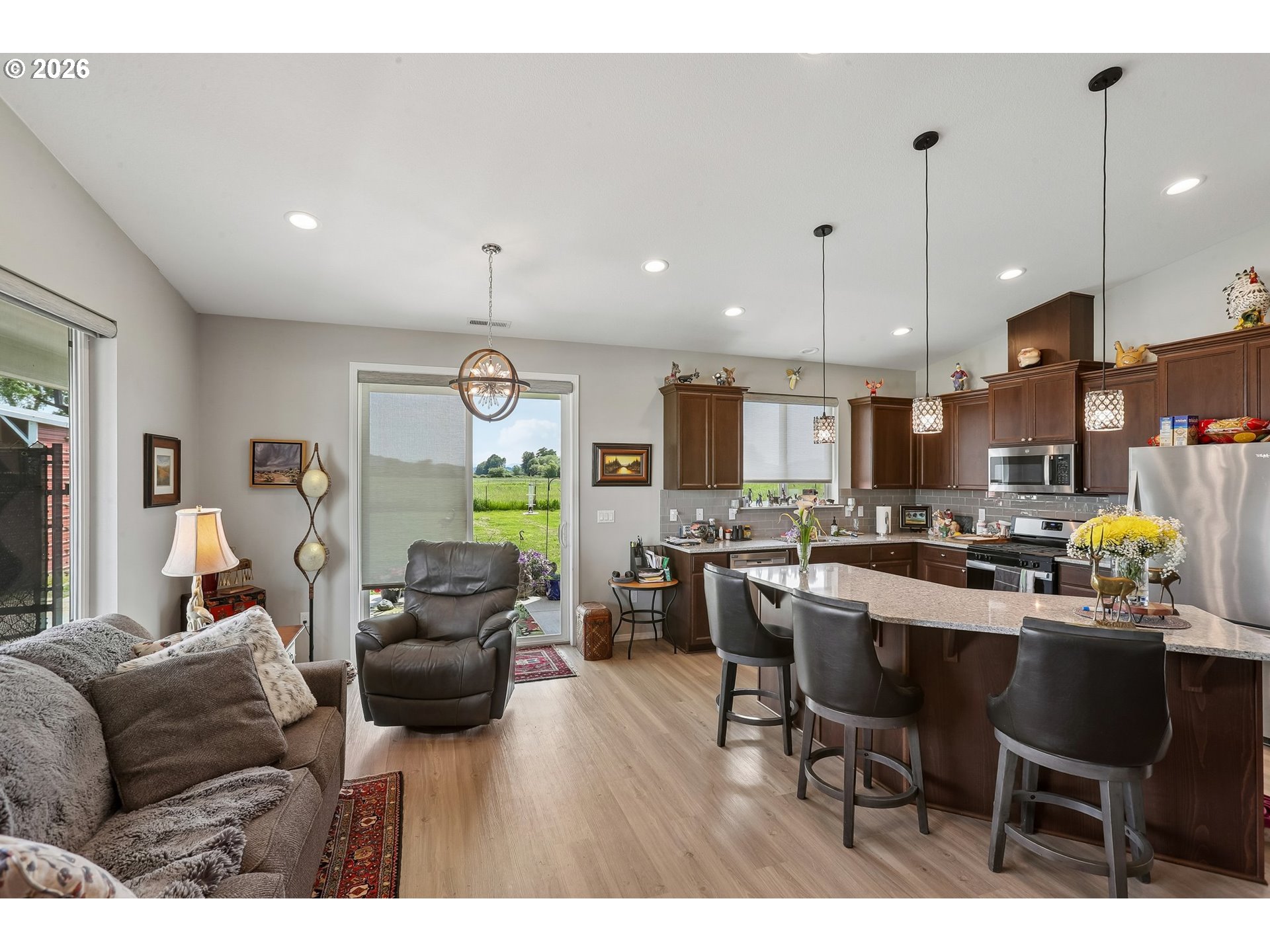298 Roberson Road Woodland, WA 98674 - Photo 31 of 48 a living room with furniture kitchen and a chandelier