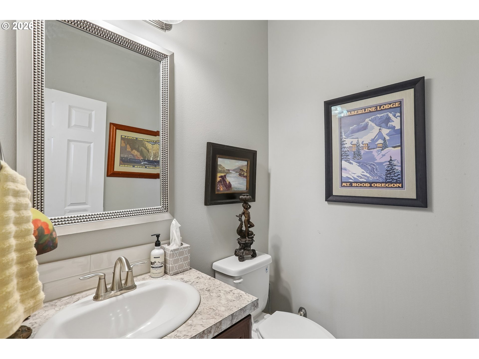 298 Roberson Road Woodland, WA 98674 - Photo 33 of 48 a bathroom with a granite countertop sink a mirror and a picture