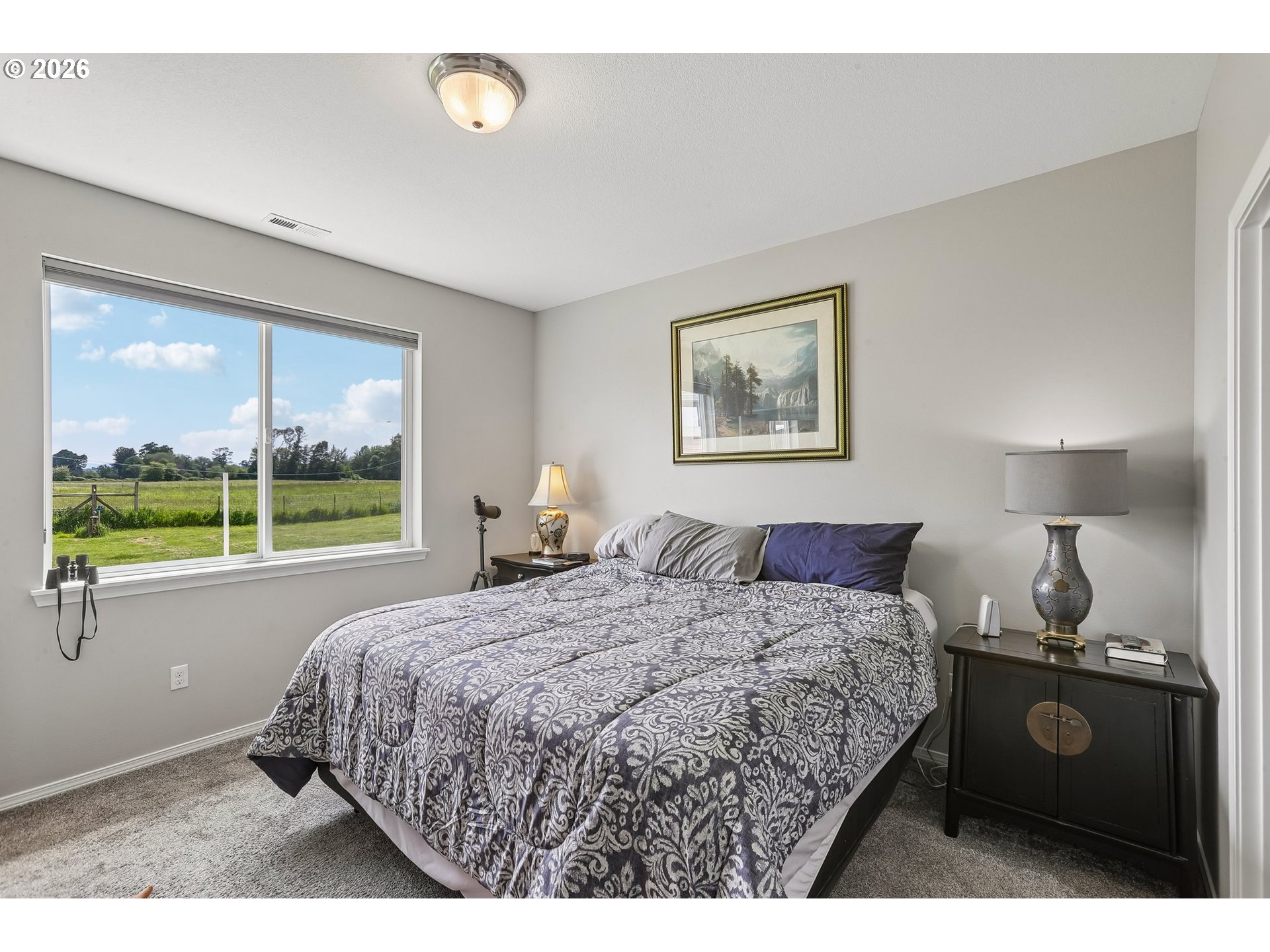 298 Roberson Road Woodland, WA 98674 - Photo 36 of 48 a bedroom with a bed and a window