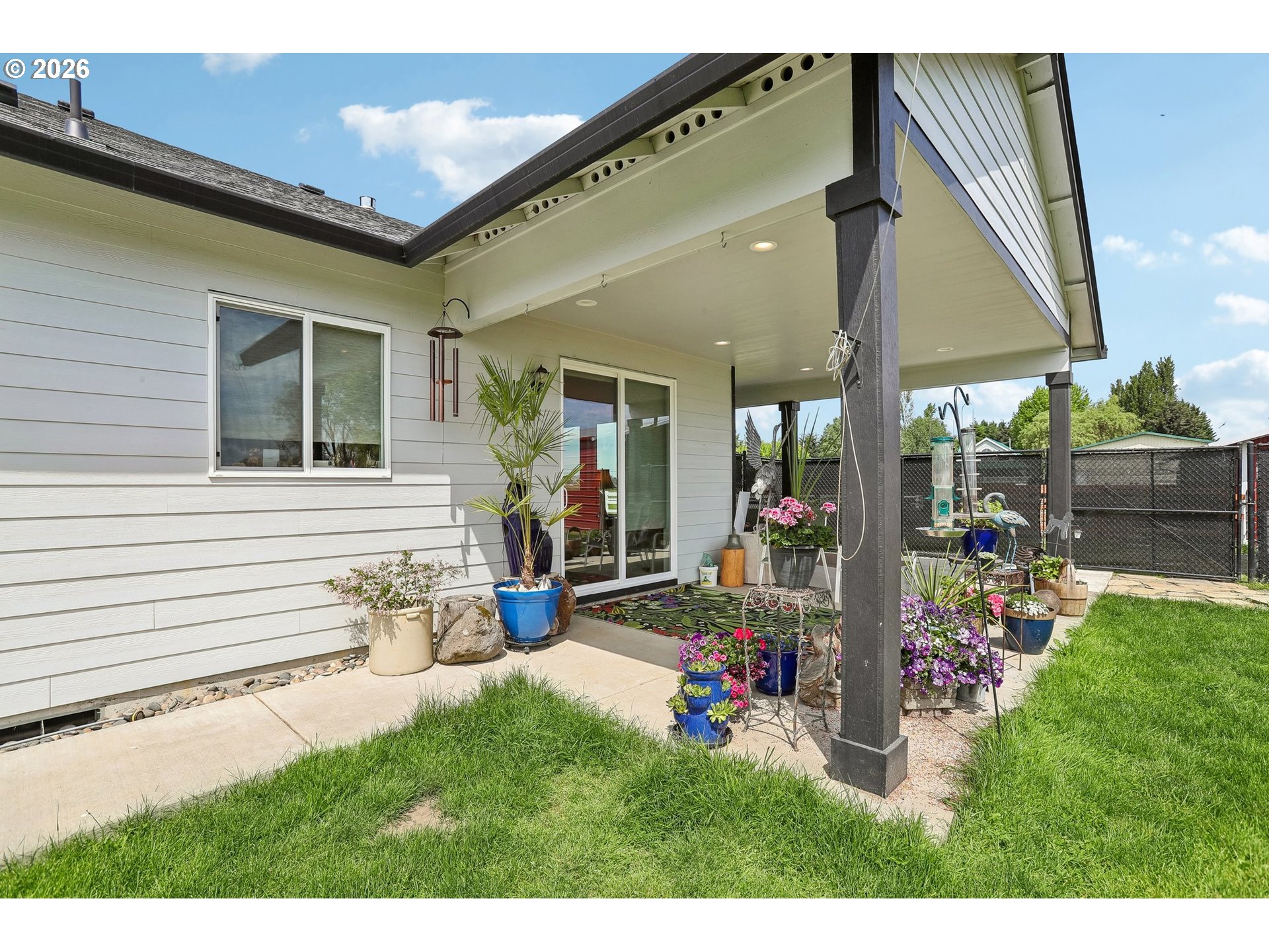298 Roberson Road Woodland, WA 98674 - Photo 37 of 48 a view of a patio with table and chairs and potted plants