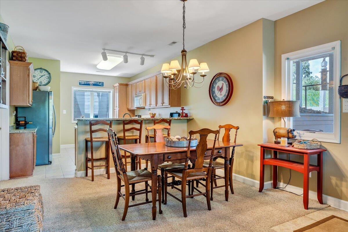 1209 Mariners Way, Unit 69 Huddleston, VA 24104 - Photo 12 of 72 a view of a dining area with furniture