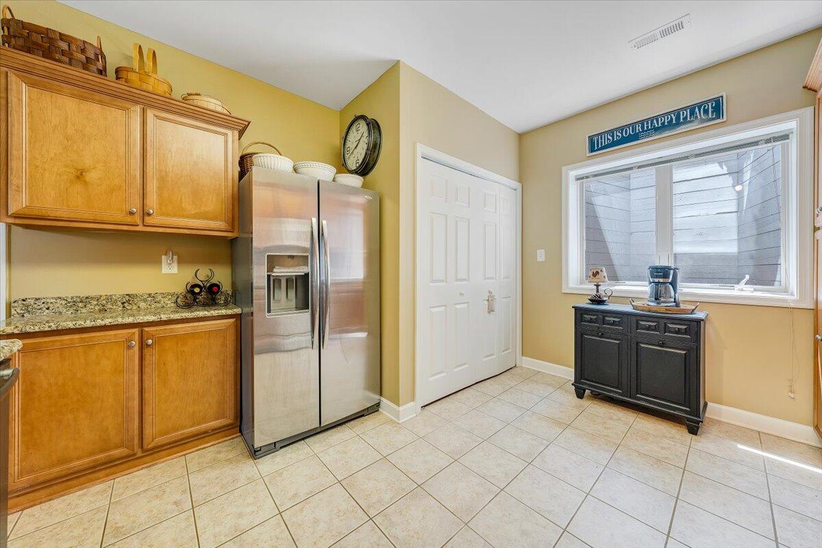 1209 Mariners Way, Unit 69 Huddleston, VA 24104 - Photo 22 of 72 a kitchen with stainless steel appliances granite countertop a refrigerator and a stove top oven