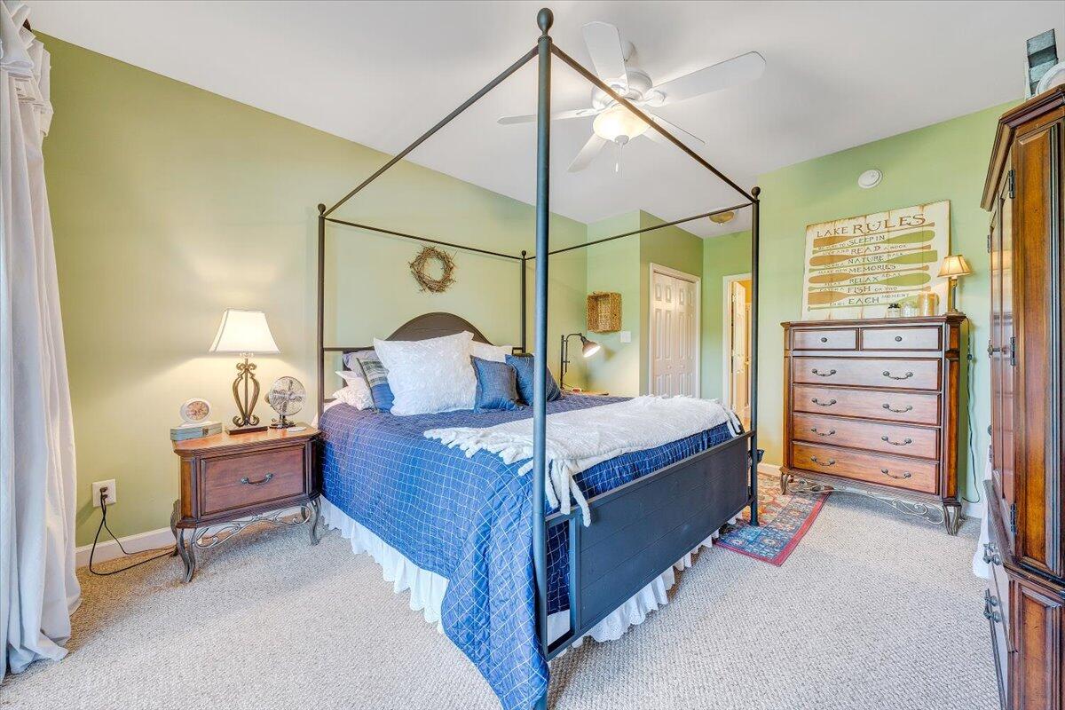 1209 Mariners Way, Unit 69 Huddleston, VA 24104 - Photo 25 of 72 a bedroom with a bed and wooden floor