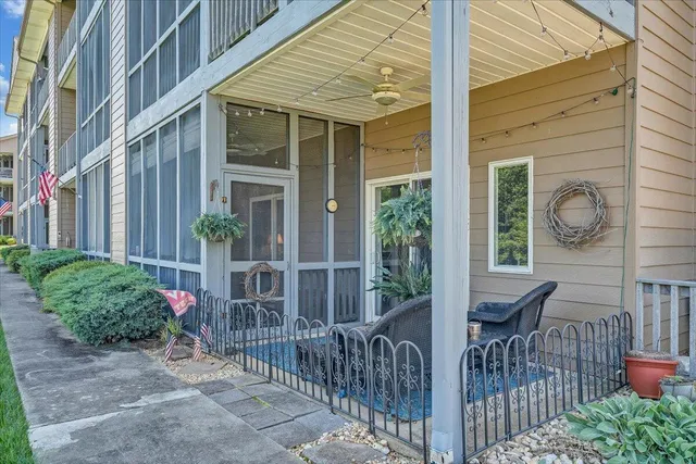 a view of a lake with houses in the back