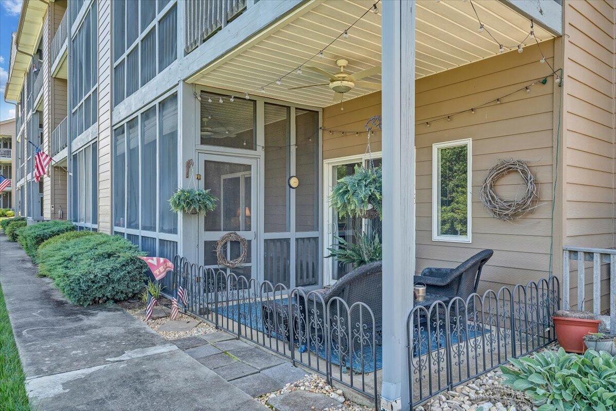 1209 Mariners Way, Unit 69 Huddleston, VA 24104 - Photo 38 of 72 a view of brick house with large windows and plants