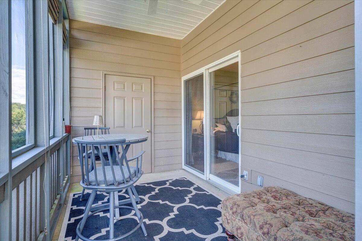 1209 Mariners Way, Unit 69 Huddleston, VA 24104 - Photo 41 of 72 a view of a porch with a table and chairs