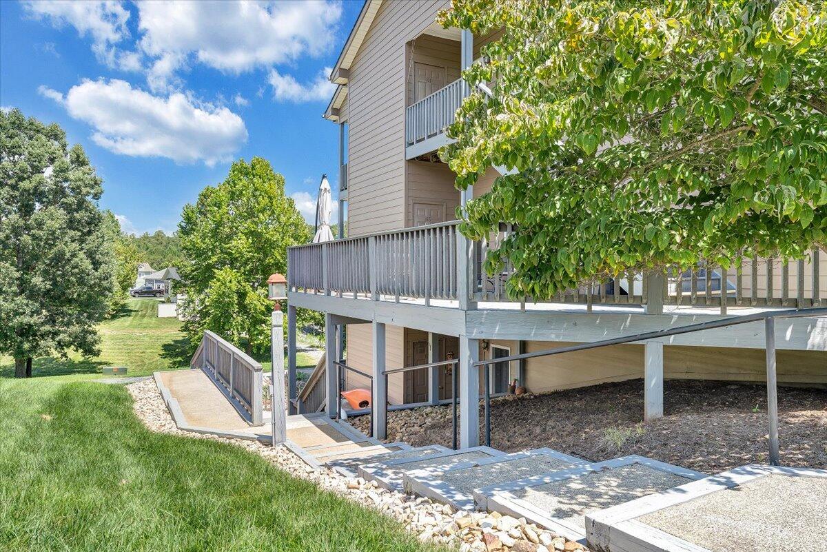 1209 Mariners Way, Unit 69 Huddleston, VA 24104 - Photo 45 of 72 a view of a house with a backyard and a patio