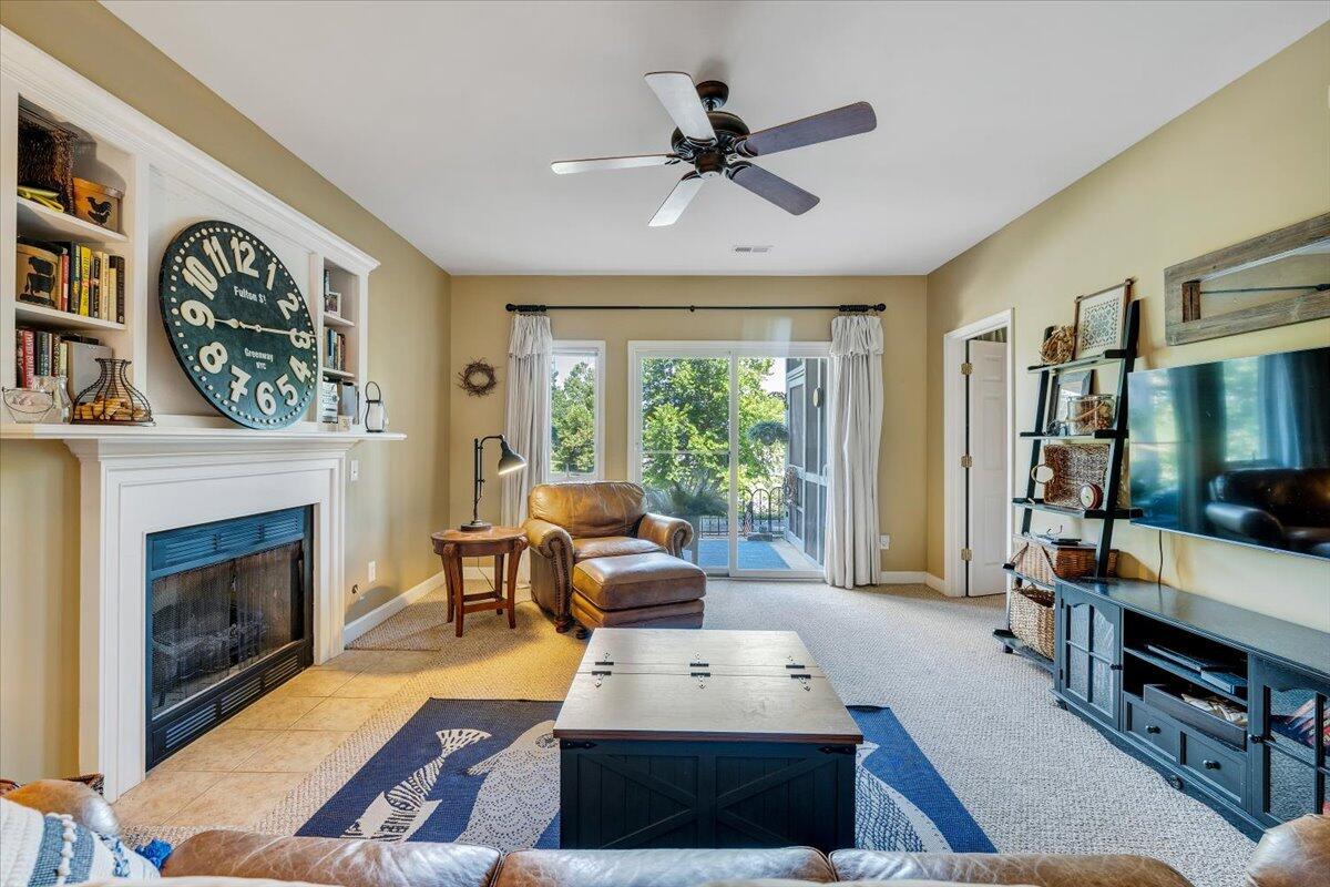 1209 Mariners Way, Unit 69 Huddleston, VA 24104 - Photo 5 of 72 a living room with furniture a flat screen tv and a fireplace