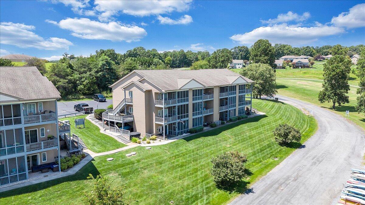 1209 Mariners Way, Unit 69 Huddleston, VA 24104 - Photo 62 of 72 an aerial view of a house with a garden and trees