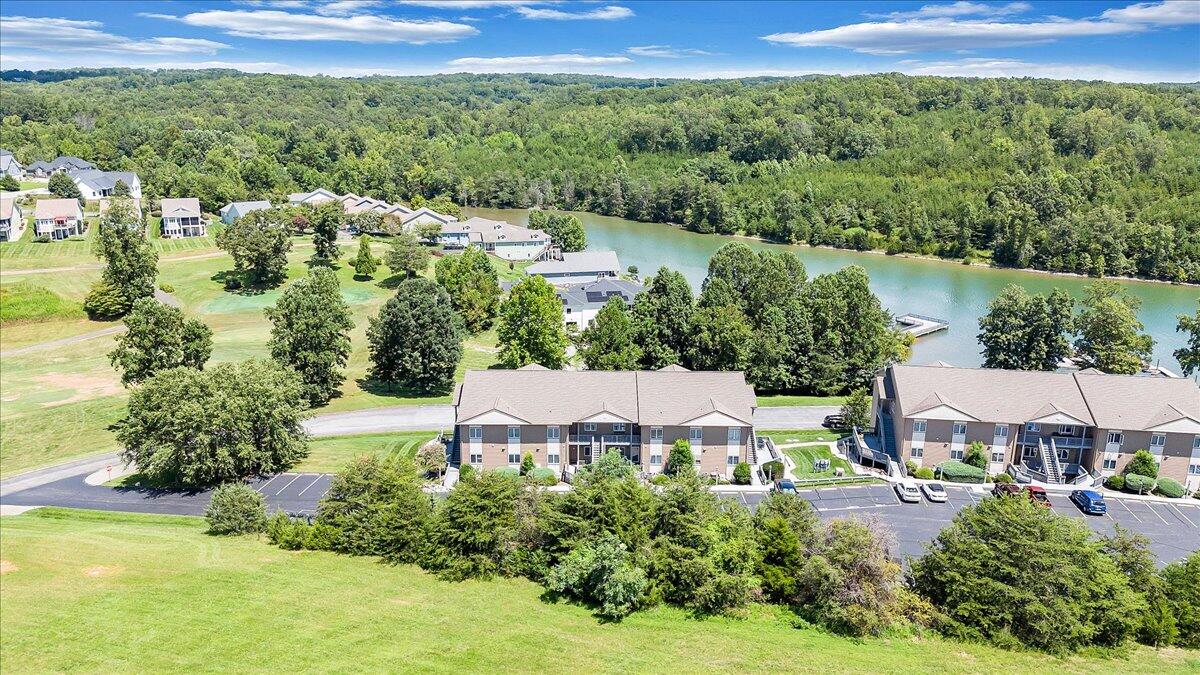 1209 Mariners Way, Unit 69 Huddleston, VA 24104 - Photo 68 of 72 a view of a house with a yard and lake view