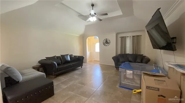 a living room with furniture and a flat screen tv