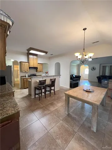 a dining room with a table and chairs