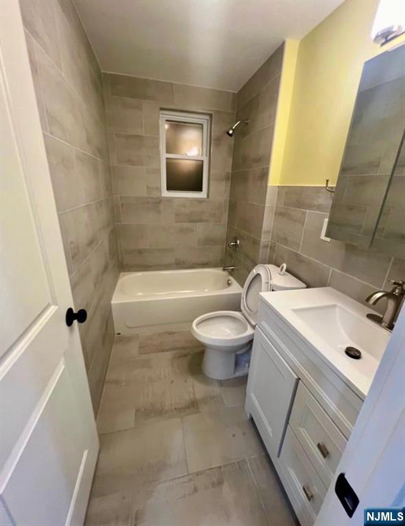 5 Chapman Street Bloomfield, NJ 07003 - Photo 3 of 5 a bathroom with a sink a toilet and shower