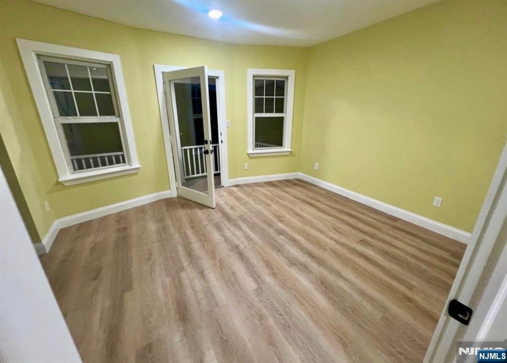 5 Chapman Street Bloomfield, NJ 07003 - Photo 4 of 5 a view of an empty room with windows