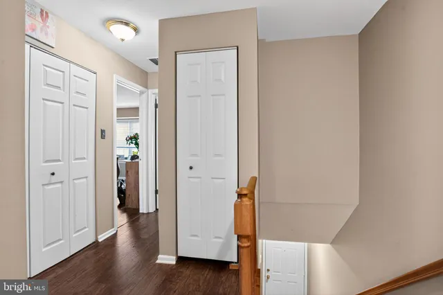 wooden floor with white walls