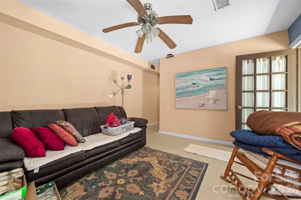 a living room with furniture and a rug