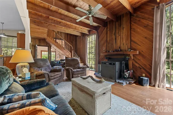a living room with furniture a window and a fireplace