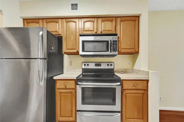 a view white cabinets and a sink