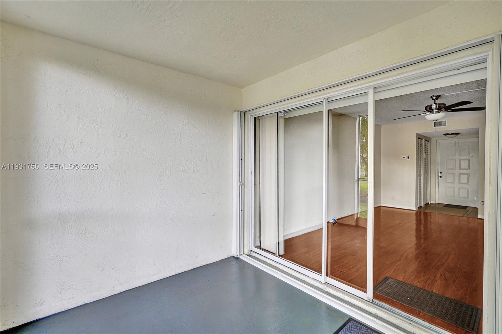 9833 Westview Drive, Unit 819 Coral Springs, FL 33076 - Photo 41 of 47 wooden floor in an empty room