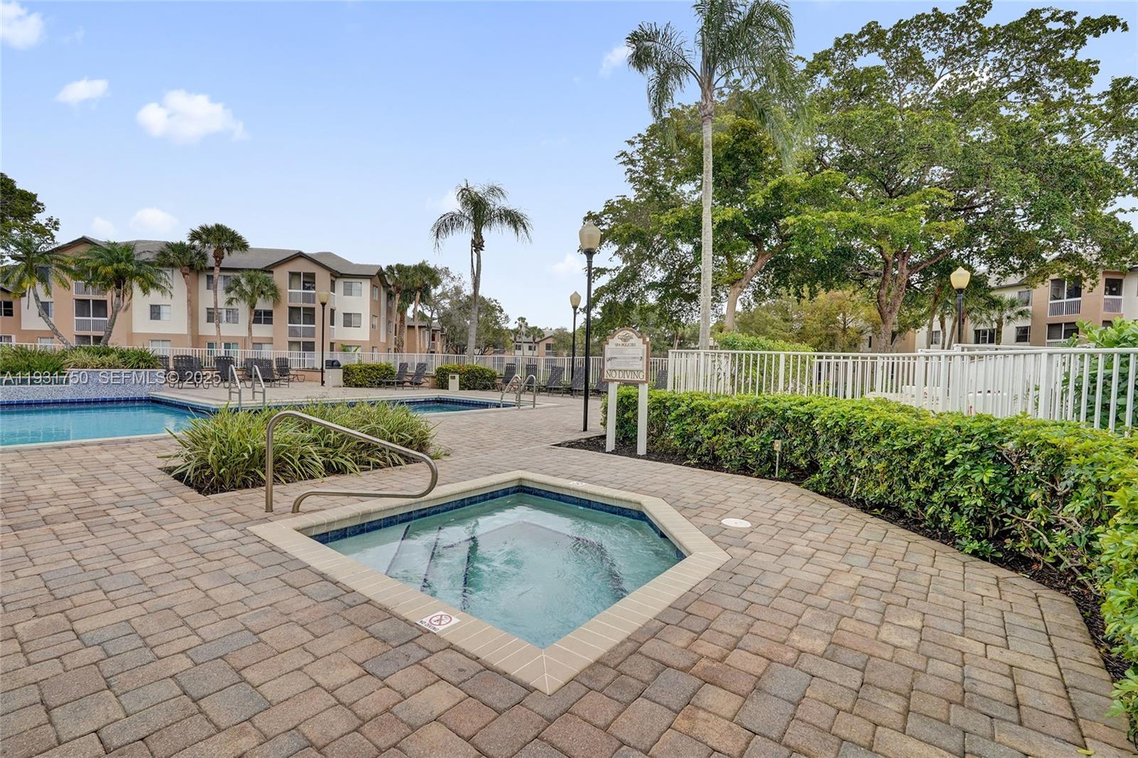 9833 Westview Drive, Unit 819 Coral Springs, FL 33076 - Photo 42 of 47 a view of a house with a yard
