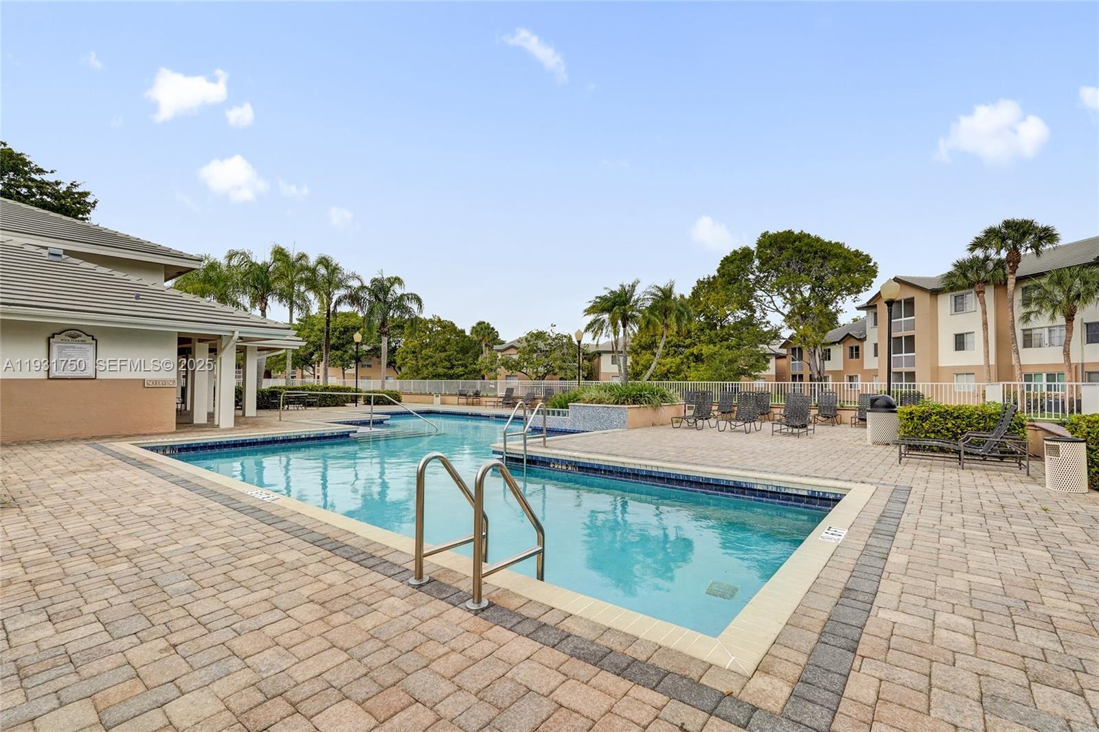 9833 Westview Drive, Unit 819 Coral Springs, FL 33076 - Photo 43 of 47 a view of swimming pool with lounge chair