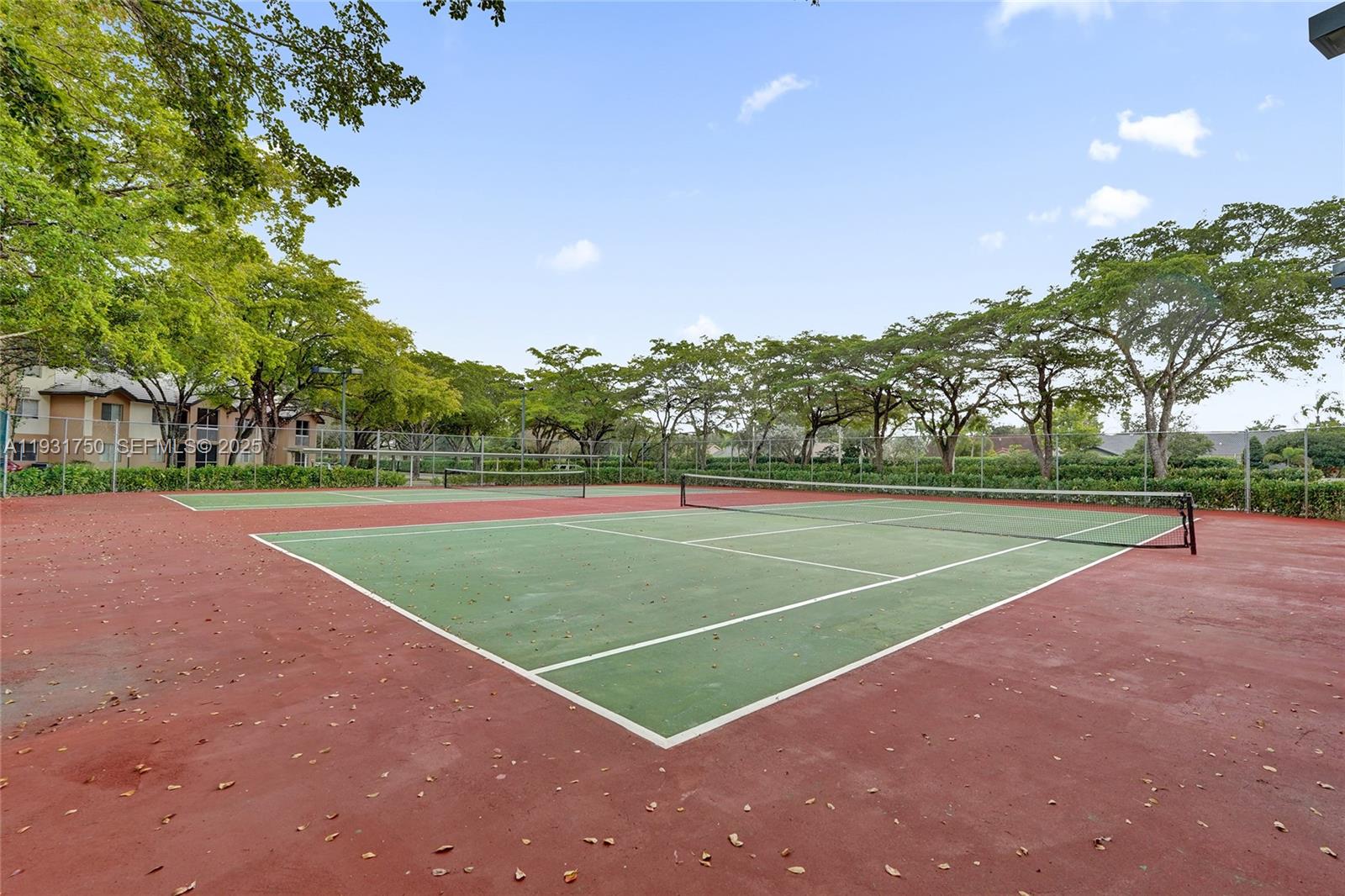 9833 Westview Drive, Unit 819 Coral Springs, FL 33076 - Photo 47 of 47 a view of a tennis court
