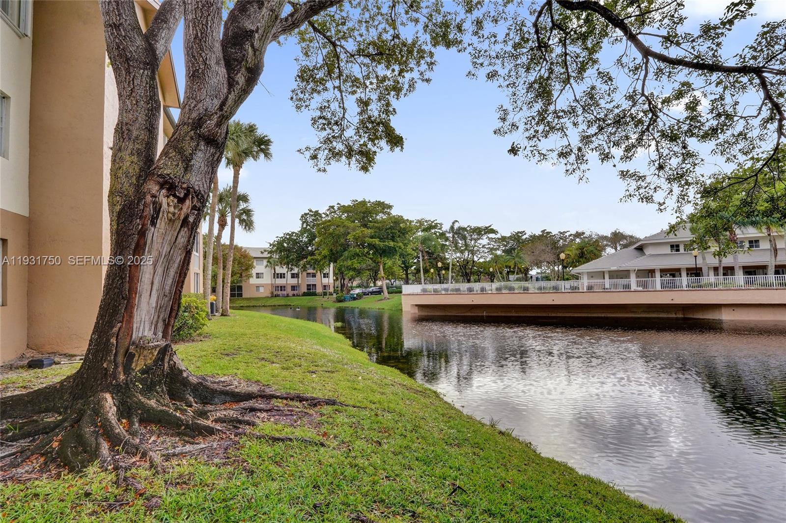 9833 Westview Drive, Unit 819 Coral Springs, FL 33076 - Photo 6 of 47 a view of a lake with houses