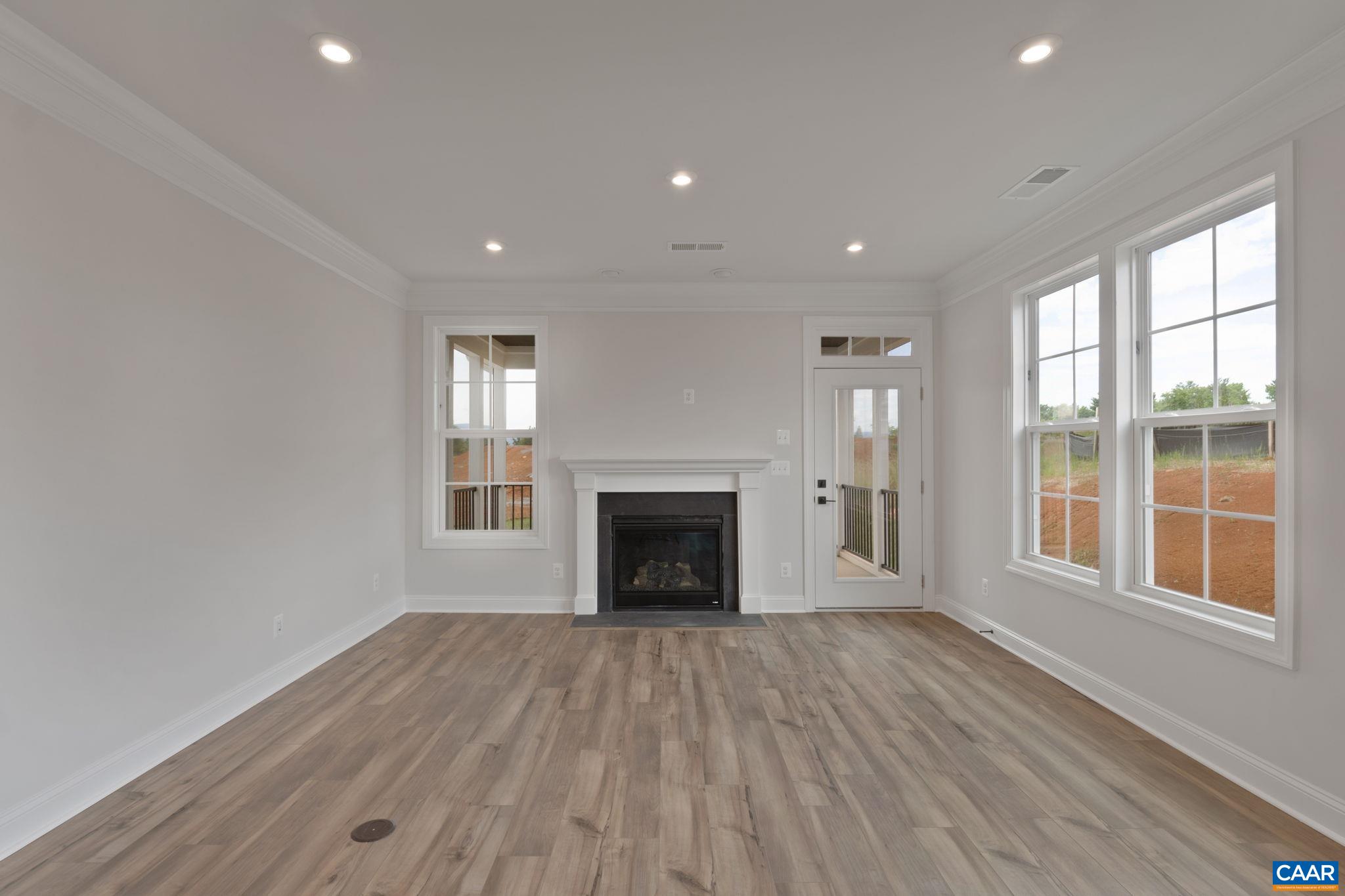 81 Springdale Road Waynesboro, VA 22980 - Photo 11 of 42 wooden floor fireplace and windows in an empty room