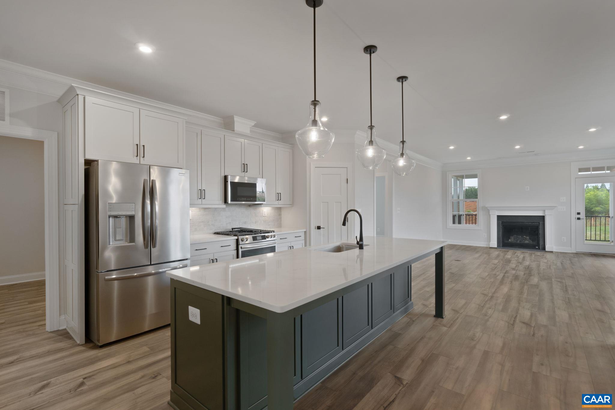 81 Springdale Road Waynesboro, VA 22980 - Photo 6 of 42 a kitchen with kitchen island a sink stainless steel appliances and wooden floor