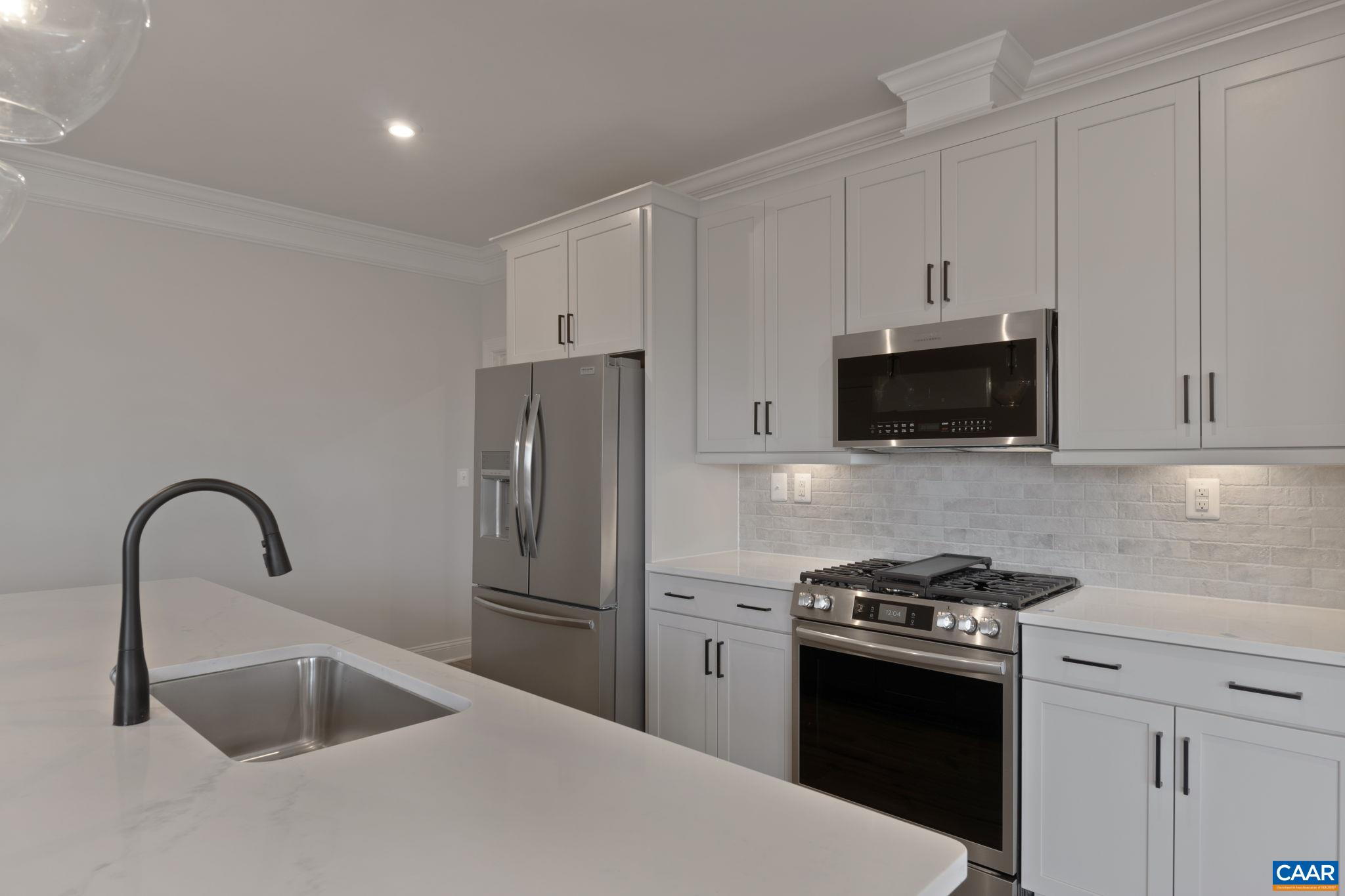 81 Springdale Road Waynesboro, VA 22980 - Photo 9 of 42 a kitchen with stainless steel appliances kitchen island a sink and a stove top oven