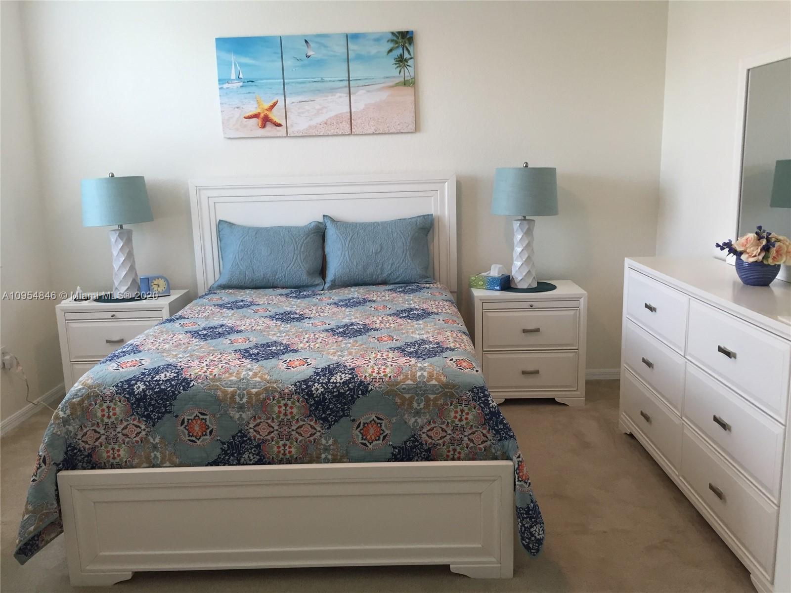 2851 Prospect Road, Unit 1306 Tamarac, FL 33309 - Photo 11 of 15 a bedroom with a bed and a window