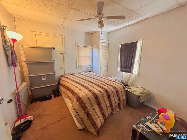 a bedroom with a bed and a walk in closet