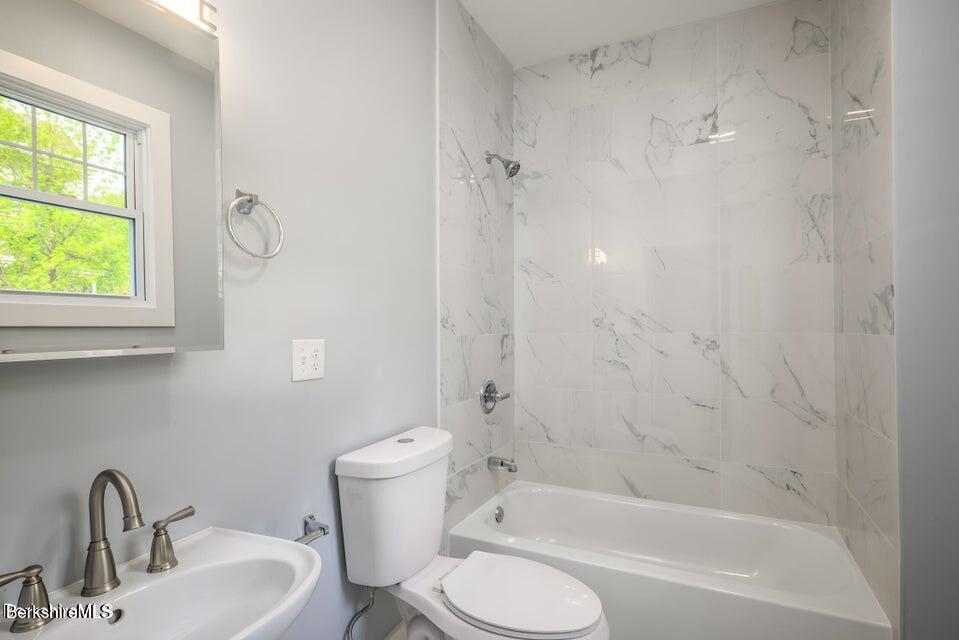 74 Washington Avenue North Adams, MA 01247 - Photo 13 of 31 a bathroom with a toilet sink vanity tub and shower