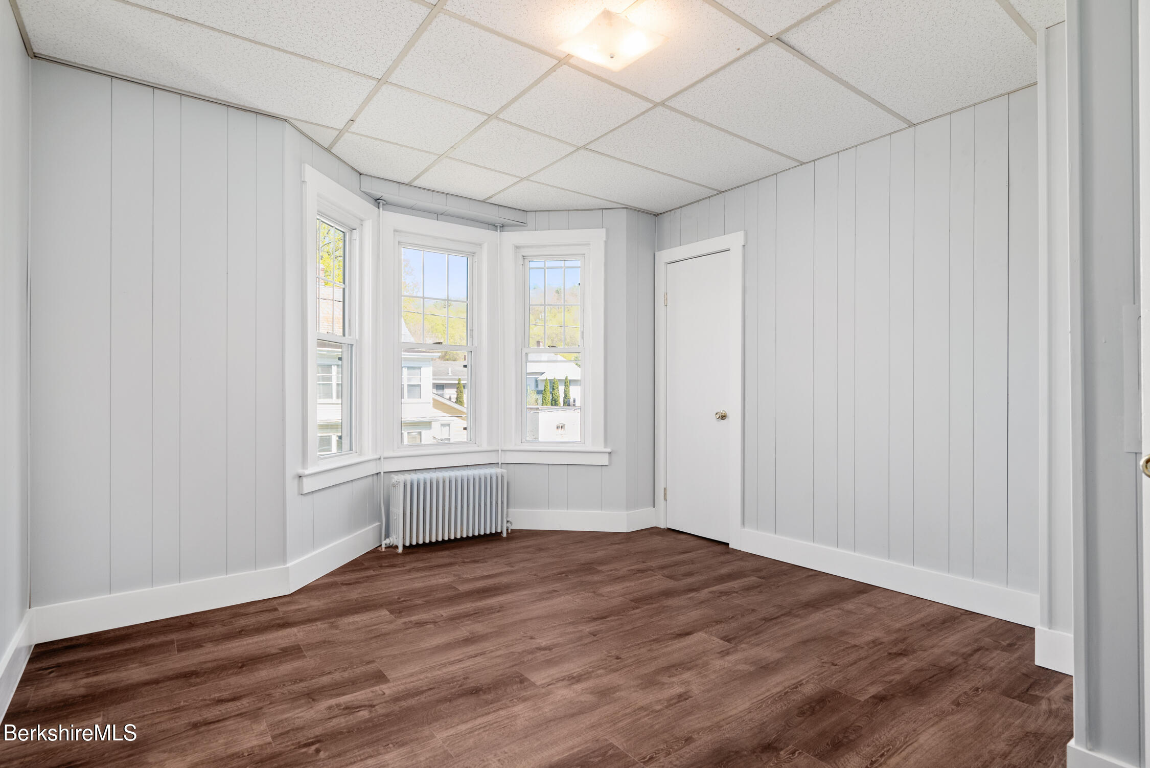 74 Washington Avenue North Adams, MA 01247 - Photo 17 of 31 a view of empty room with wooden floor and fan