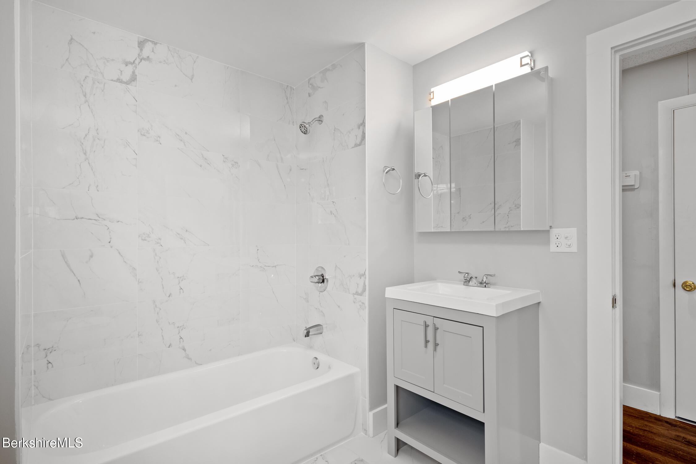 74 Washington Avenue North Adams, MA 01247 - Photo 19 of 31 a bathroom with a bathtub a sink a vanity and a shower