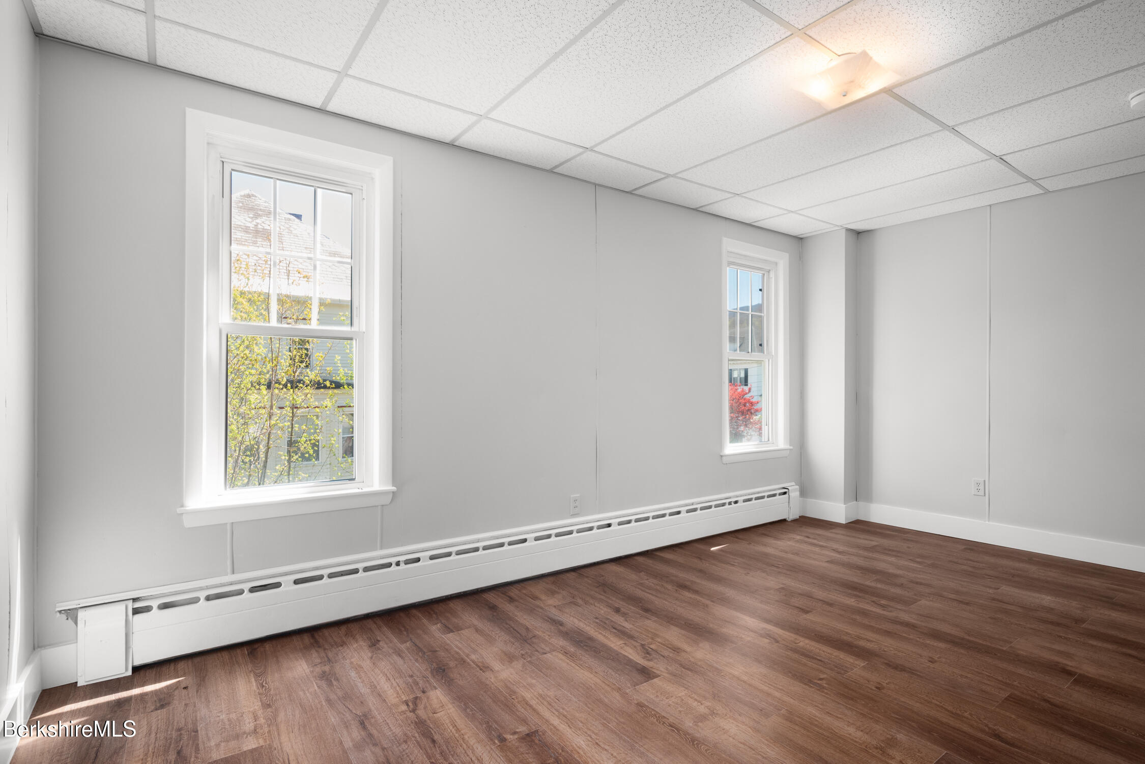 74 Washington Avenue North Adams, MA 01247 - Photo 20 of 31 an empty room with wooden floor and windows