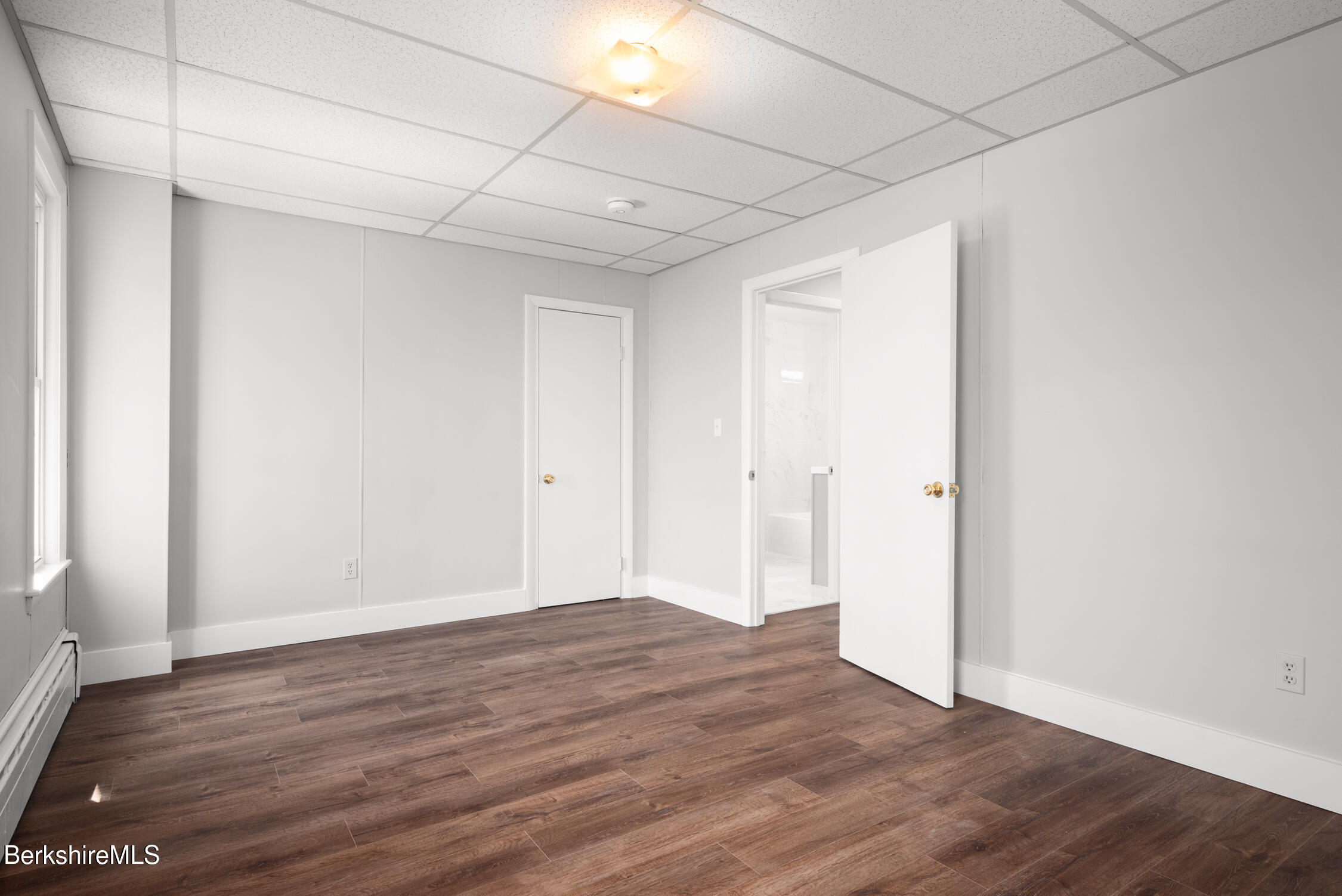 74 Washington Avenue North Adams, MA 01247 - Photo 21 of 31 a view of an empty room with wooden floor