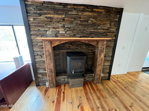 a view of a livingroom with furniture and a fireplace