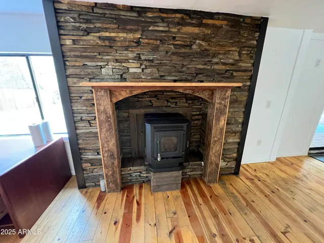 a view of a livingroom with furniture and a fireplace