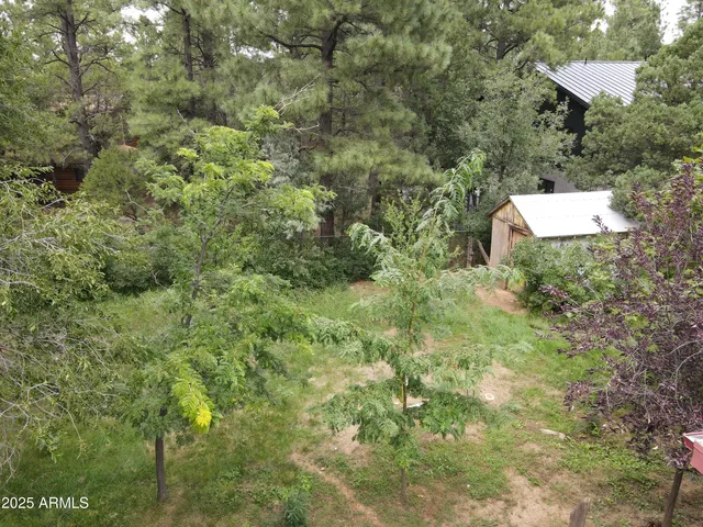 an aerial view of a house with yard and outdoor space