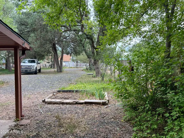 a backyard of a house with oven and outdoor seating