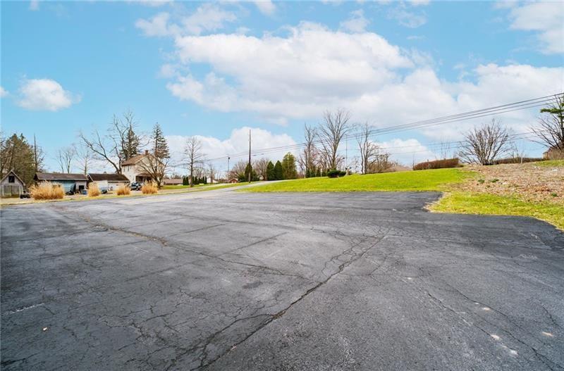 3030 Wilmington Road New Castle, PA 16105 - Photo 2 of 41 a view of an swimming pool with an outdoor space and seating area