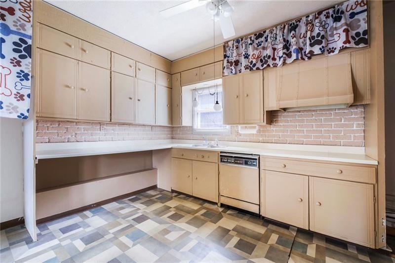 3030 Wilmington Road New Castle, PA 16105 - Photo 21 of 41 a kitchen with granite countertop white cabinets and white appliances