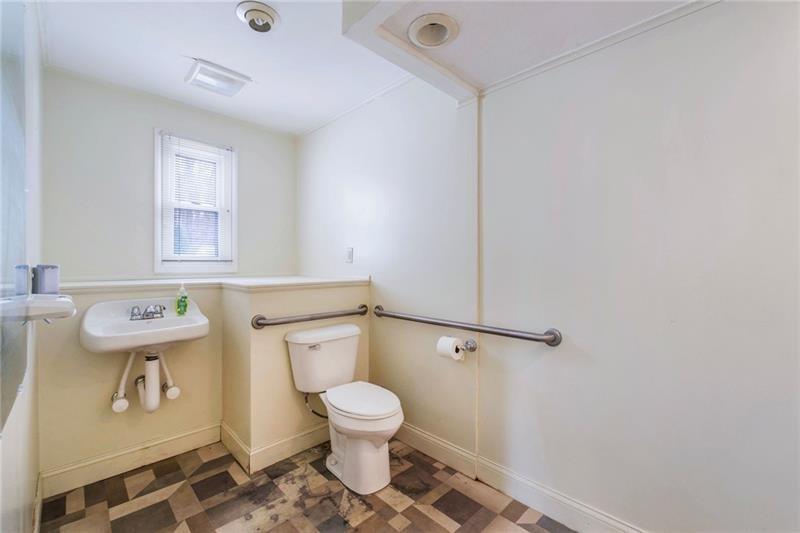 3030 Wilmington Road New Castle, PA 16105 - Photo 31 of 41 a white toilet sitting next to a bathroom sink